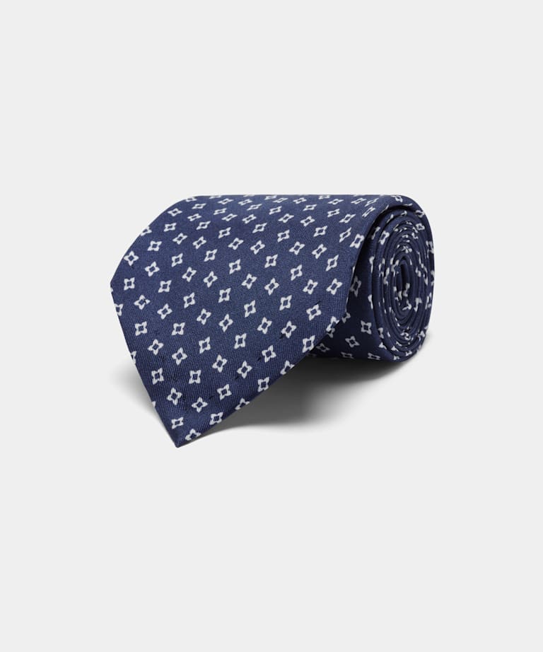 Cravate bleu marine à fleurs