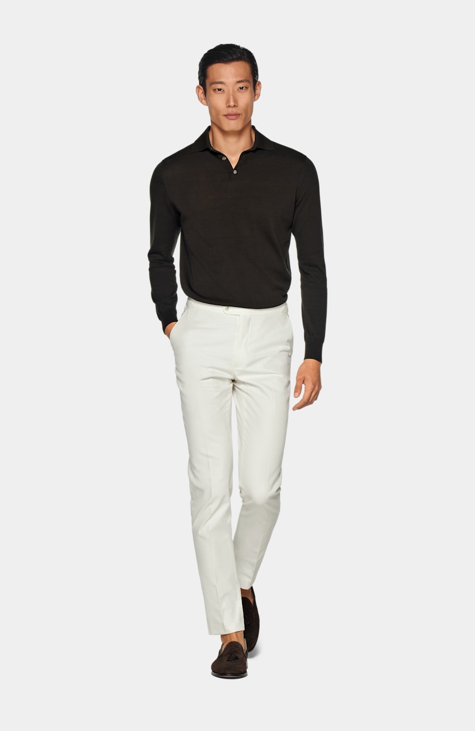 White polo 2025 and brown pants