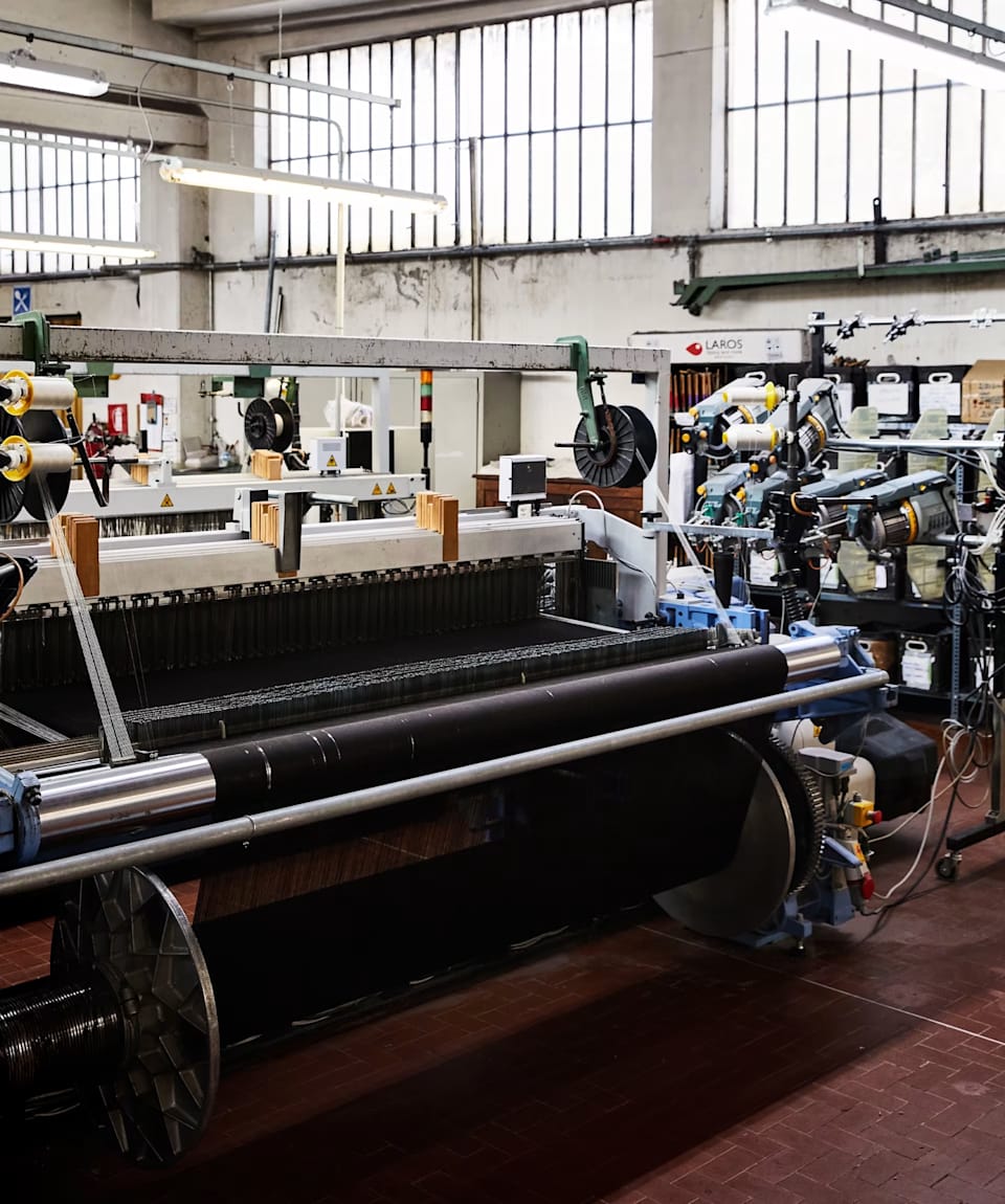 Colorful cashmere yarn spools in the Rogna mill