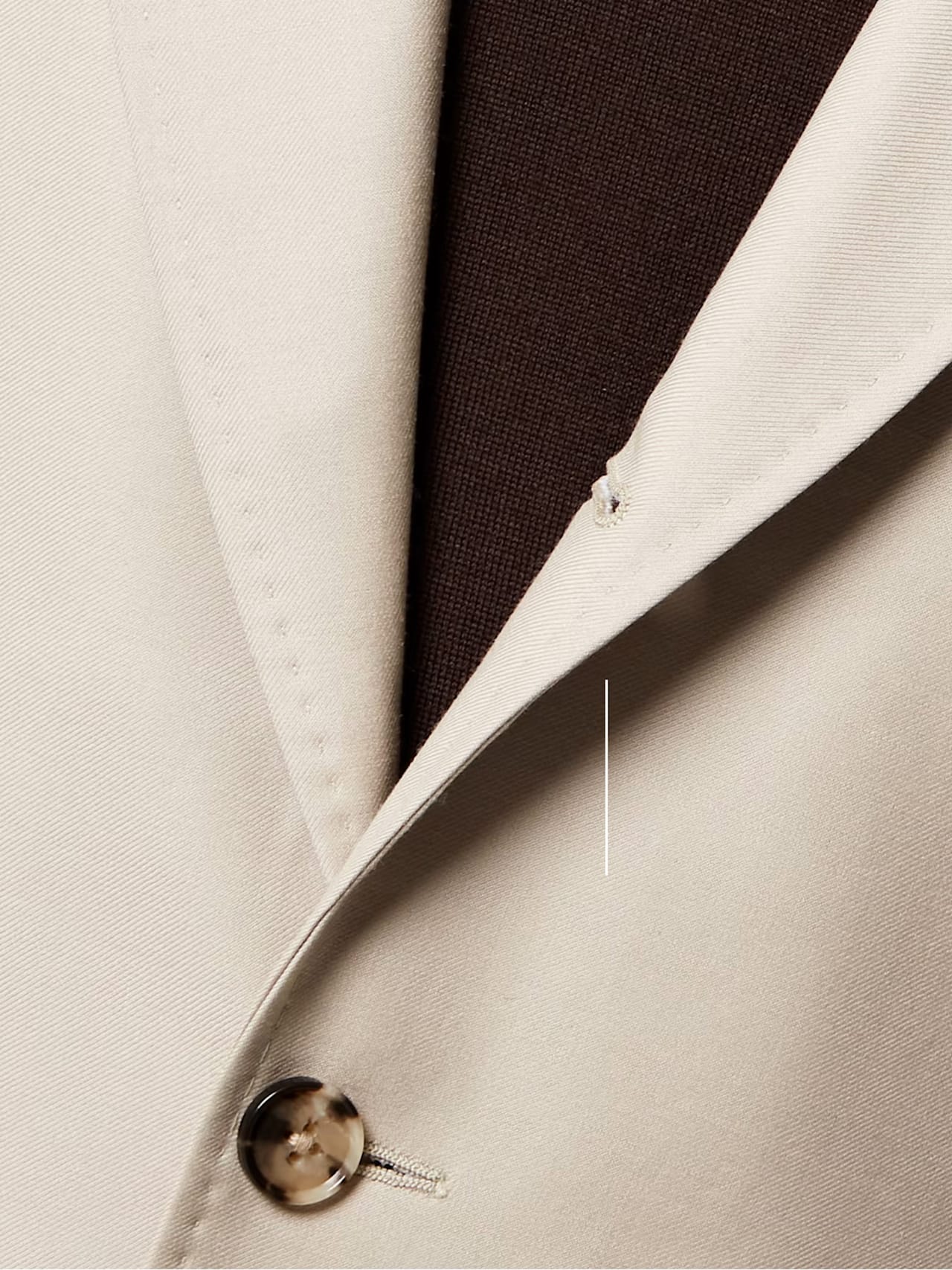 Suit lapel with button close-up