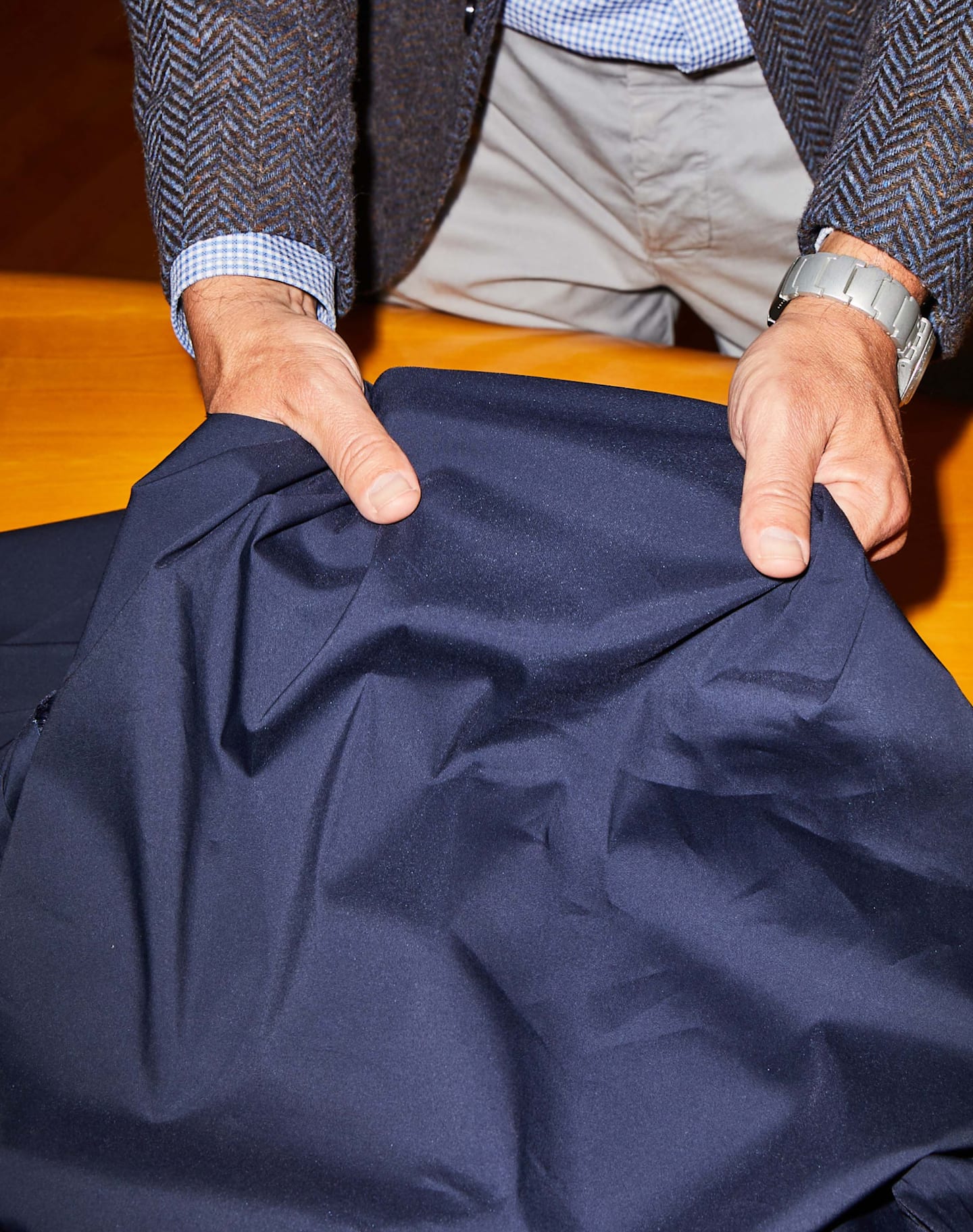 Fabrics are hand-inspected for quality and consistency.