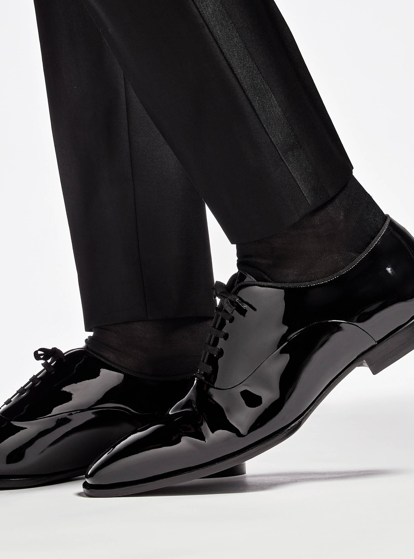 Completing the black tie tuxedo look with patent leather shoes from Suitsupply.
