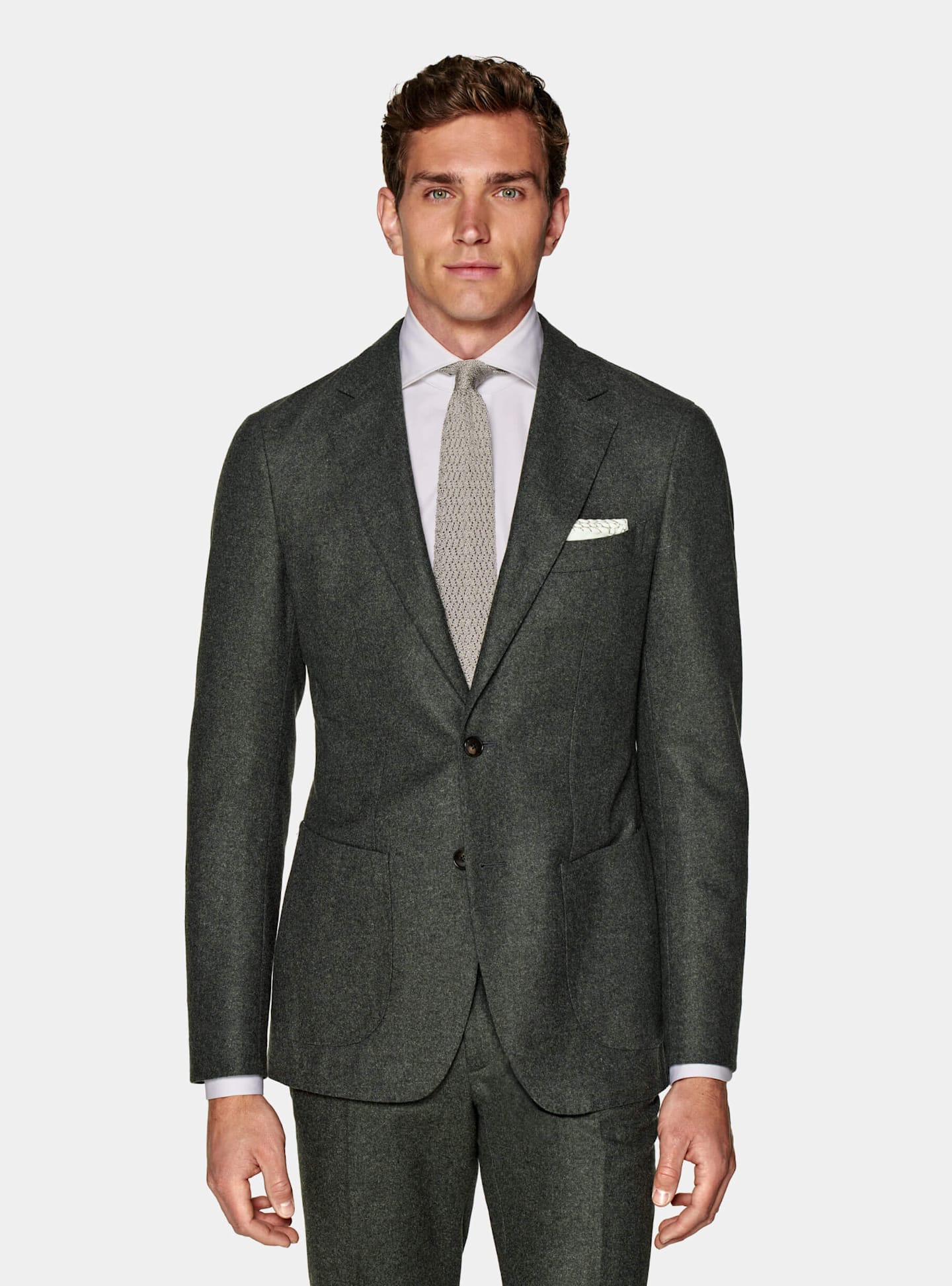 A winter wedding look with a warm single-breasted green circular flannel suit. 