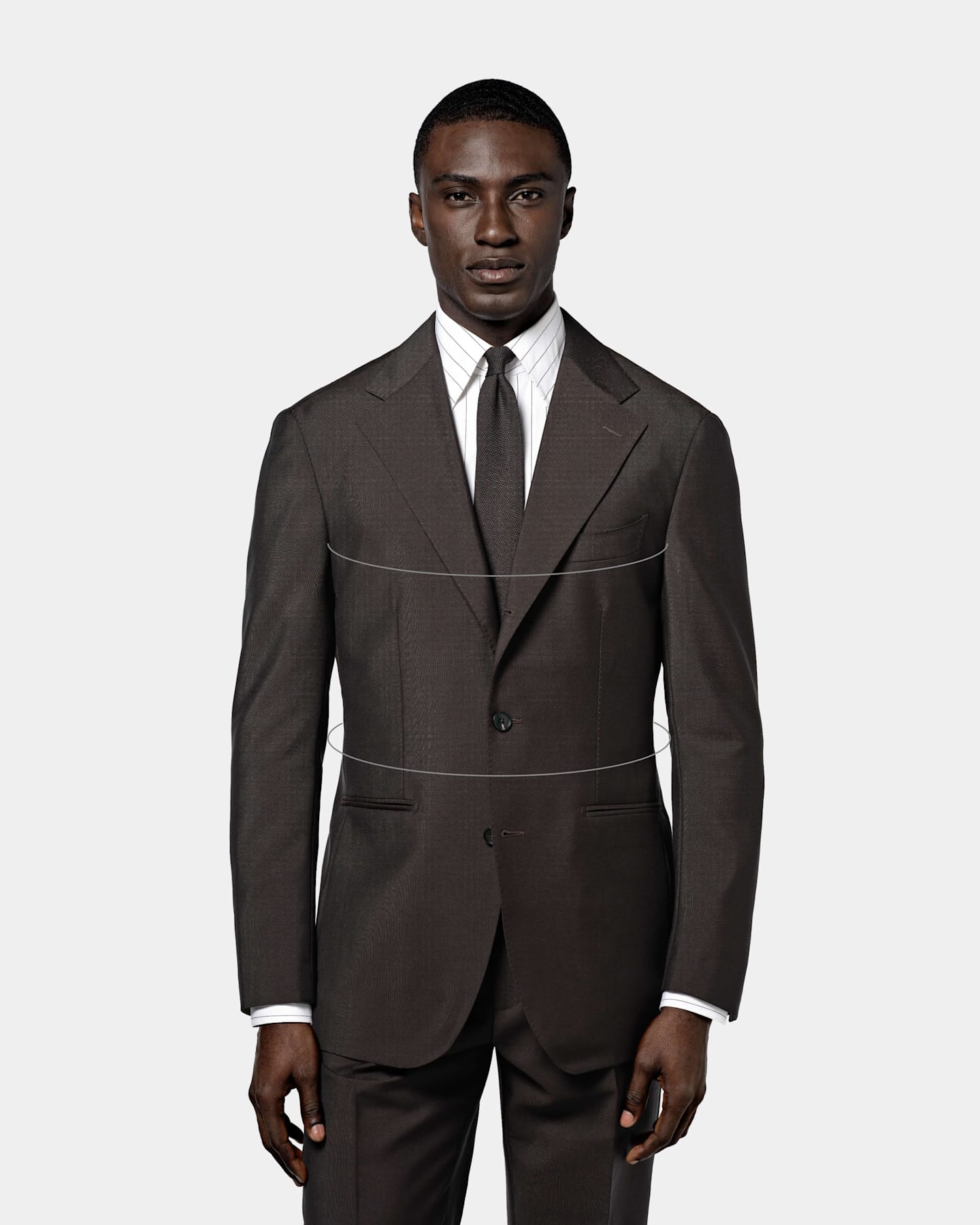 A man in a suit illustrates proper jacket fit, emphasizing roomier chest and waist