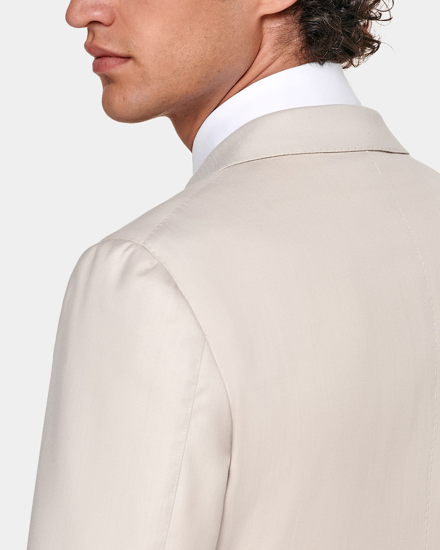 light brown jacket with pleated shoulder