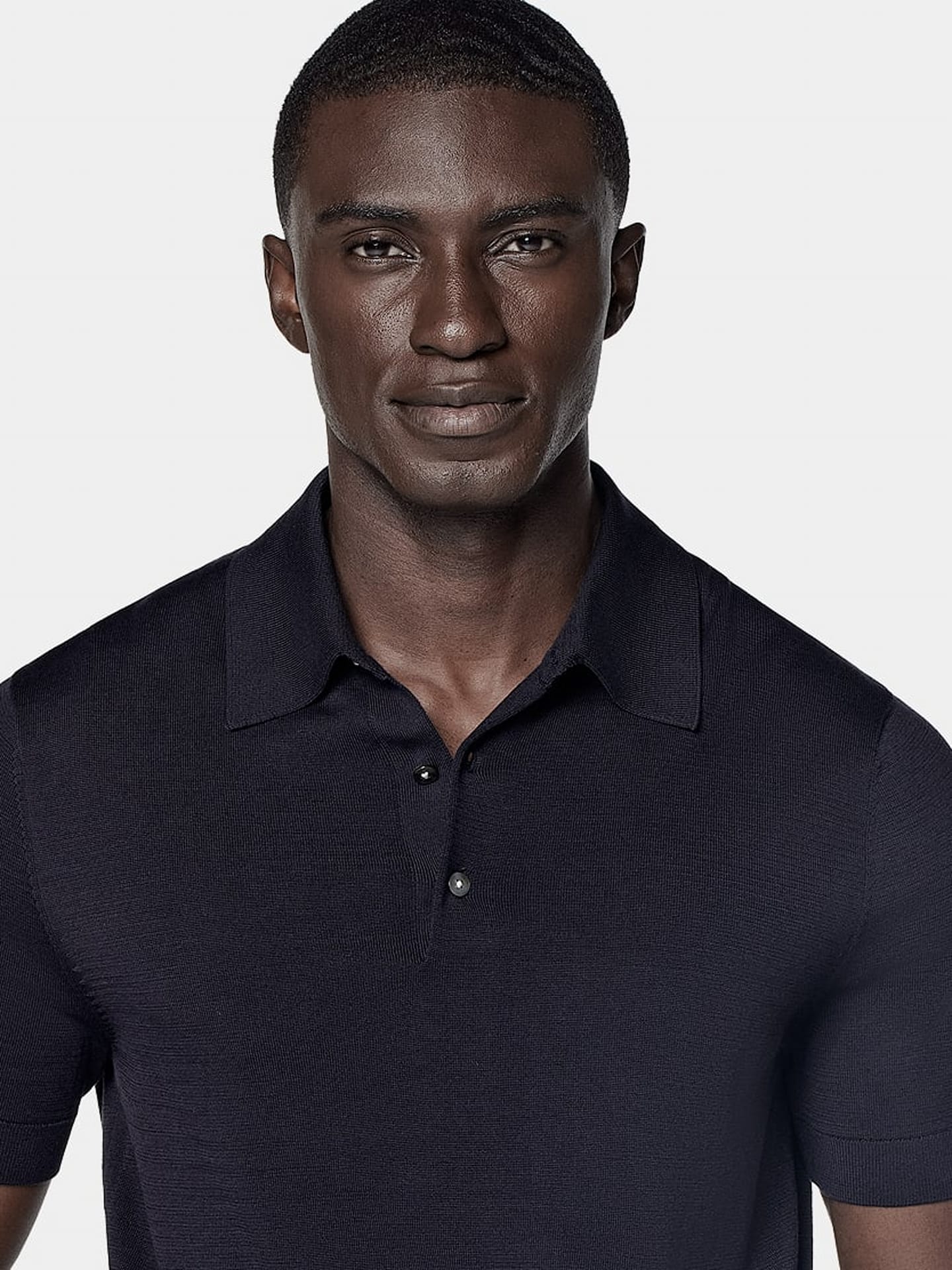 Navy short-sleeve polo shirt with open collar