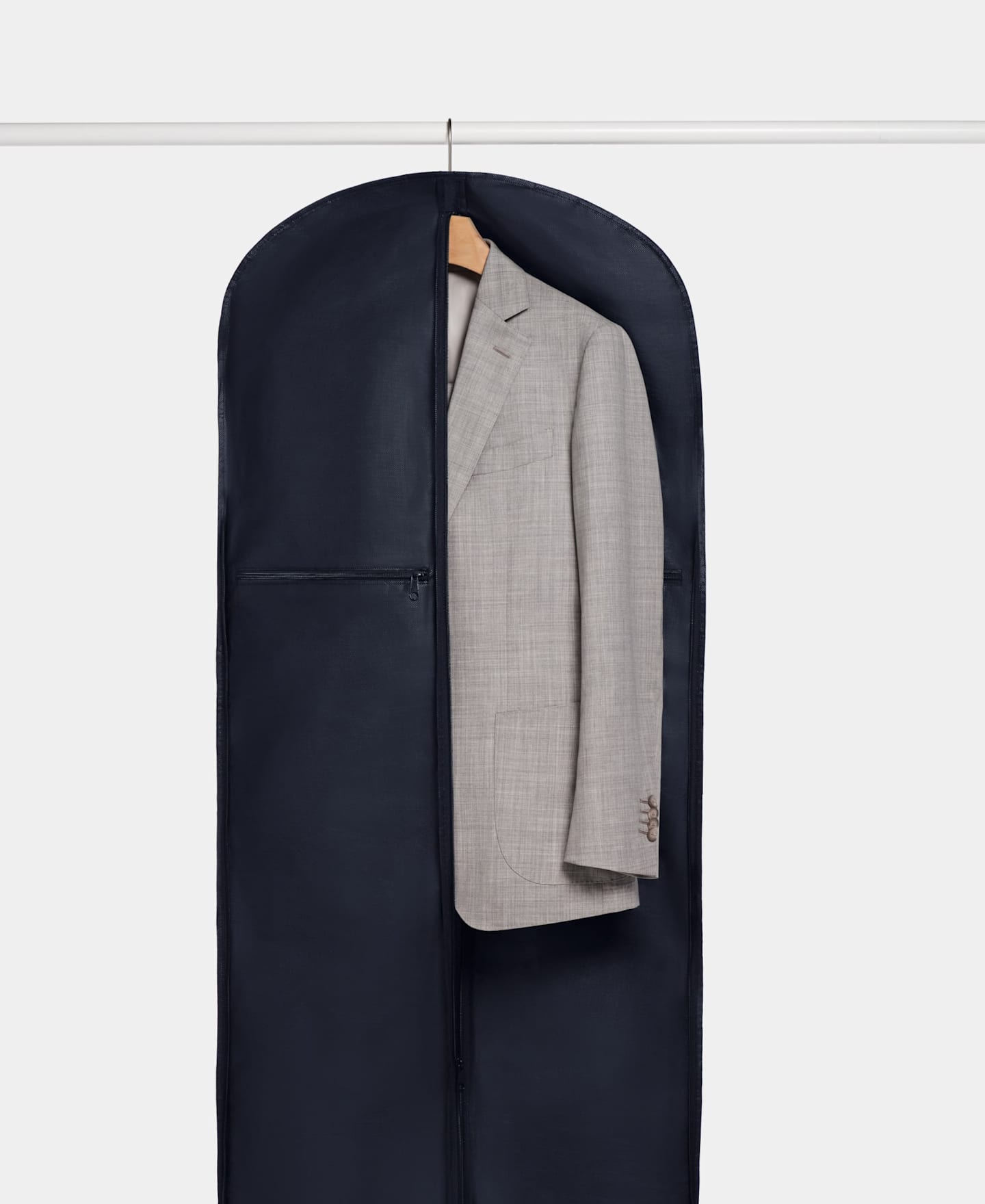 Light grey suit jacket packed in blue garment bag