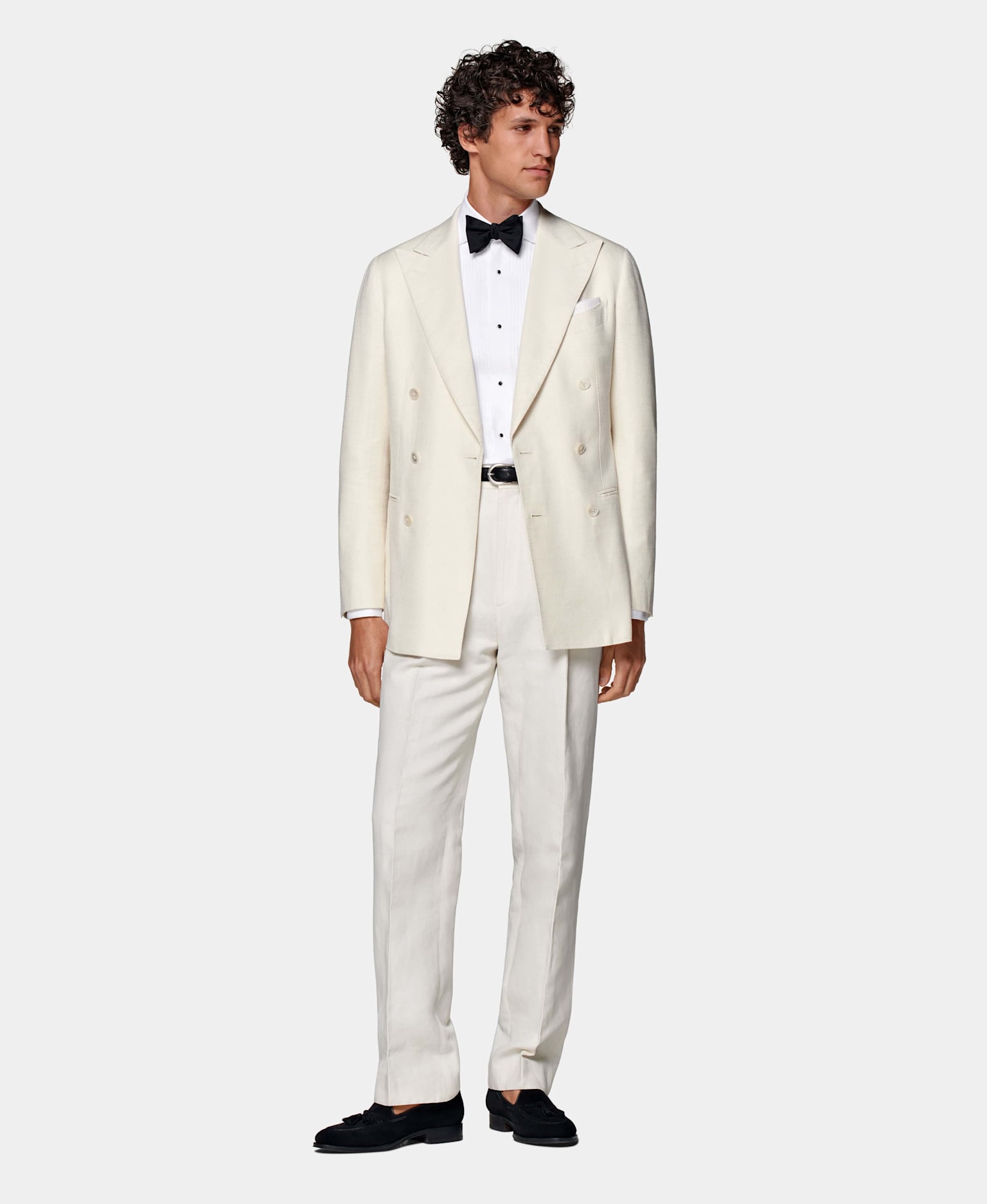 Instead of a traditional black tuxedo , opt in for a white double breasted look.