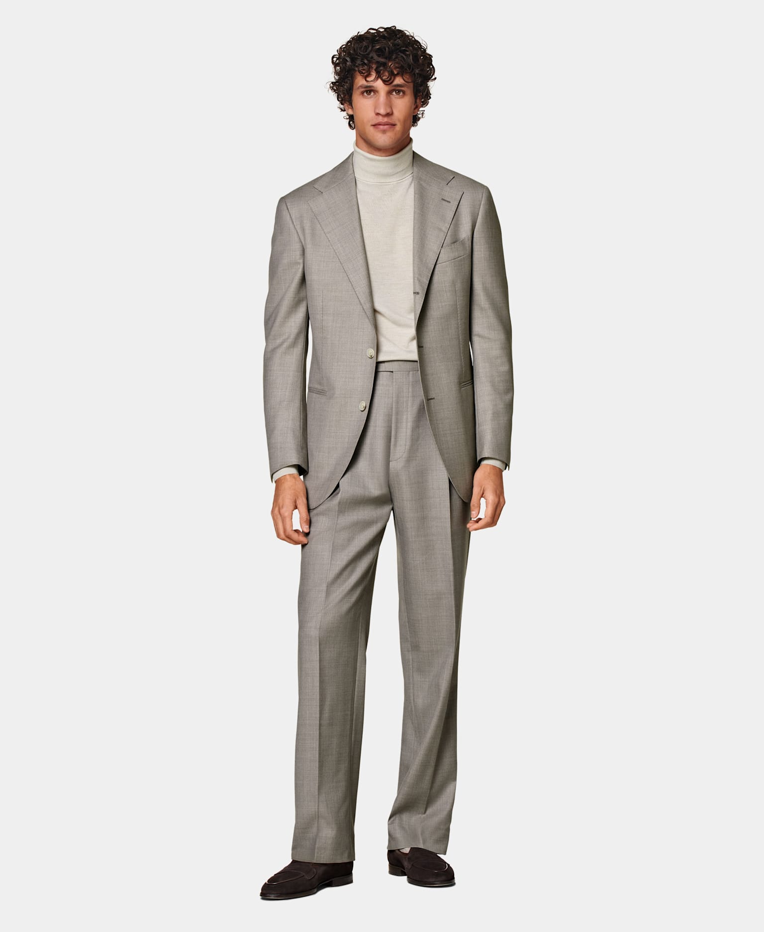 Taupe single-breasted suit with light taupe turtleneck.