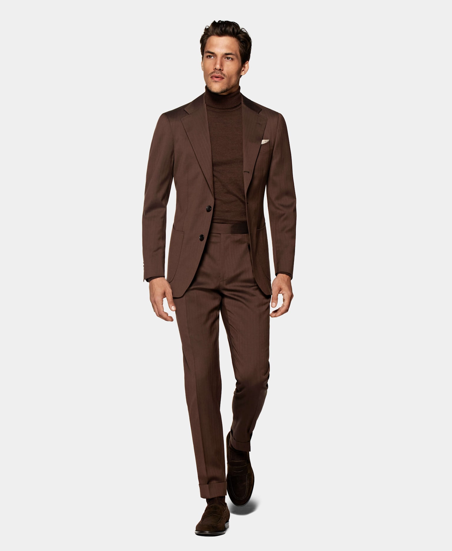 Make a statement in this brown havana suit, paired up with a silk turtleneck.