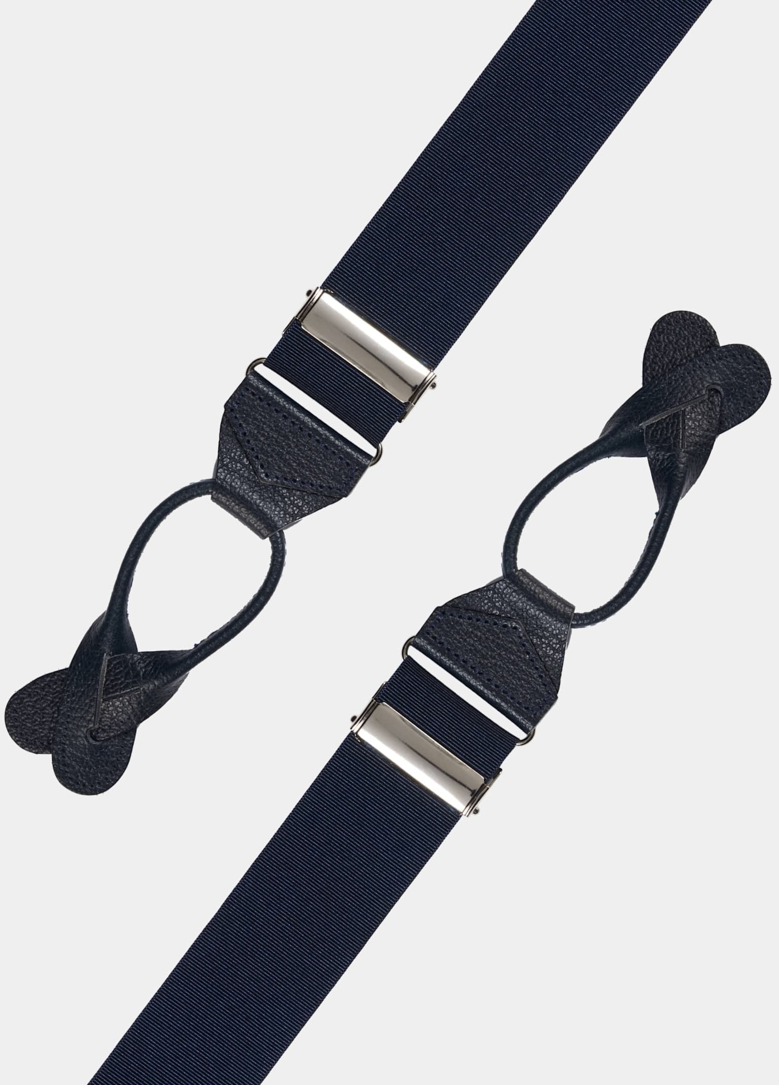 Suspenders with leather buckles.