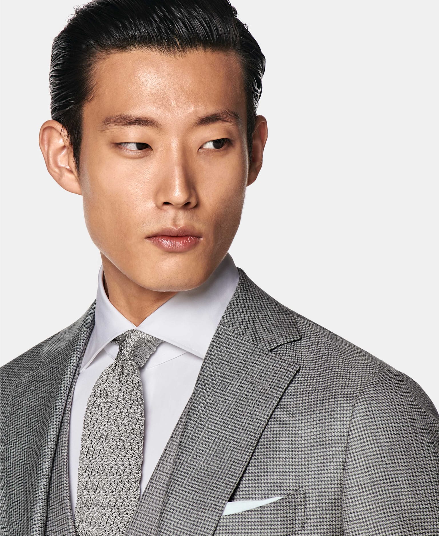 Image of a winter formal suit, featuring an alpaca wool blend houndstooth look.