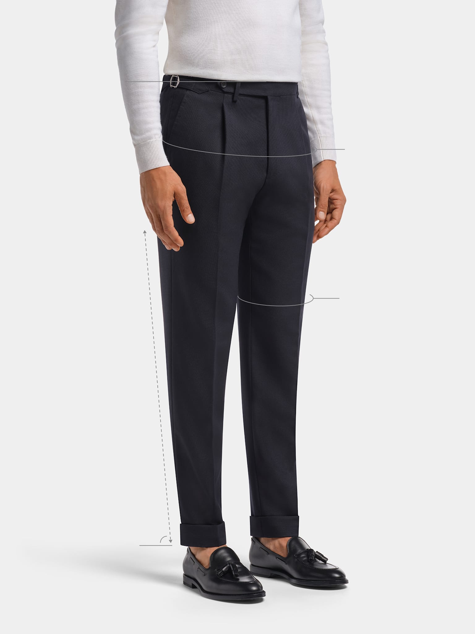 Navy slim, tapered fit trousers with white knit and sockless loafers.